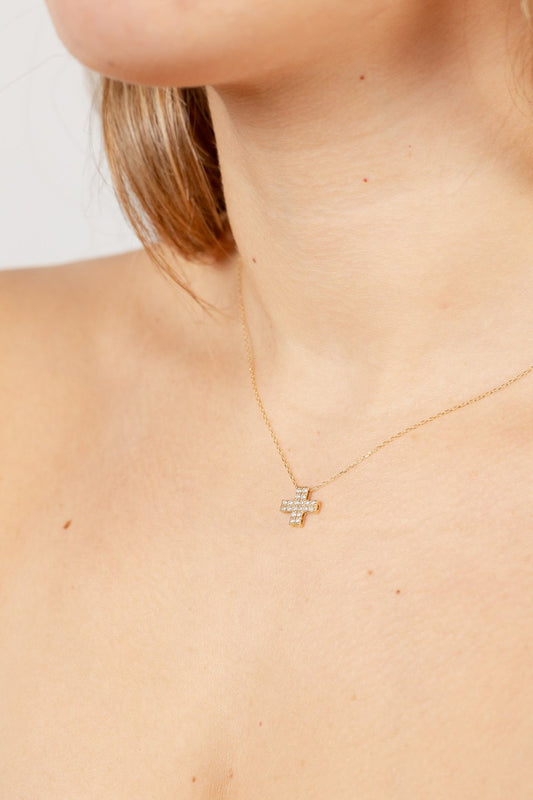 Colgante cruz doble con diamantes